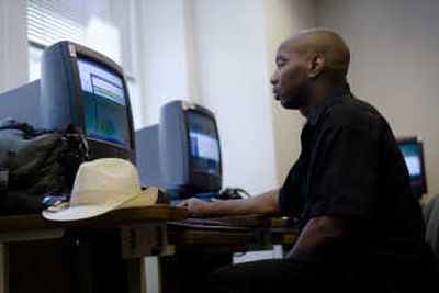 
Michael Shane Simmons checks his e-mail, waiting to hear back about a job with a city summer arts program at the Pennsylvania CareerLink office in downtown Philadelphia on Friday. Associated Press
 (Associated Press / The Spokesman-Review)
