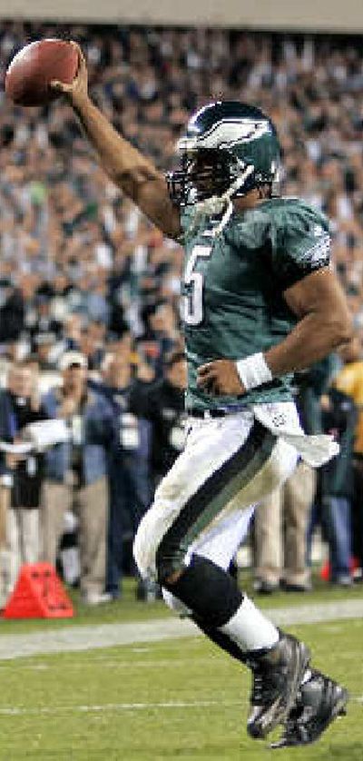 
Eagles quarterback Donovan McNabb jogs in for a second-quarter score. 
 (Associated Press / The Spokesman-Review)