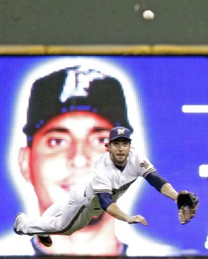 Milwaukee Brewers left fielder Ryan Braun makes a diving catch on a ball hit by Florida Marlins' Omar Infante during the fifth inning of a baseball game on Friday, Sept. 23, 2011, in Milwaukee. (Morry Gash / Associated Press)