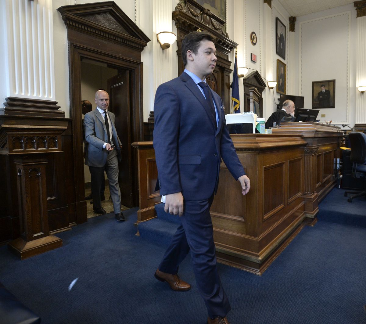 Kyle Rittenhouse, center, walks into the courtroom with attorney Corey Chirafisi for a motion hearing in Kenosha, Wis., on Friday, Sept. 17, 2021.  (Sean Krajacic)