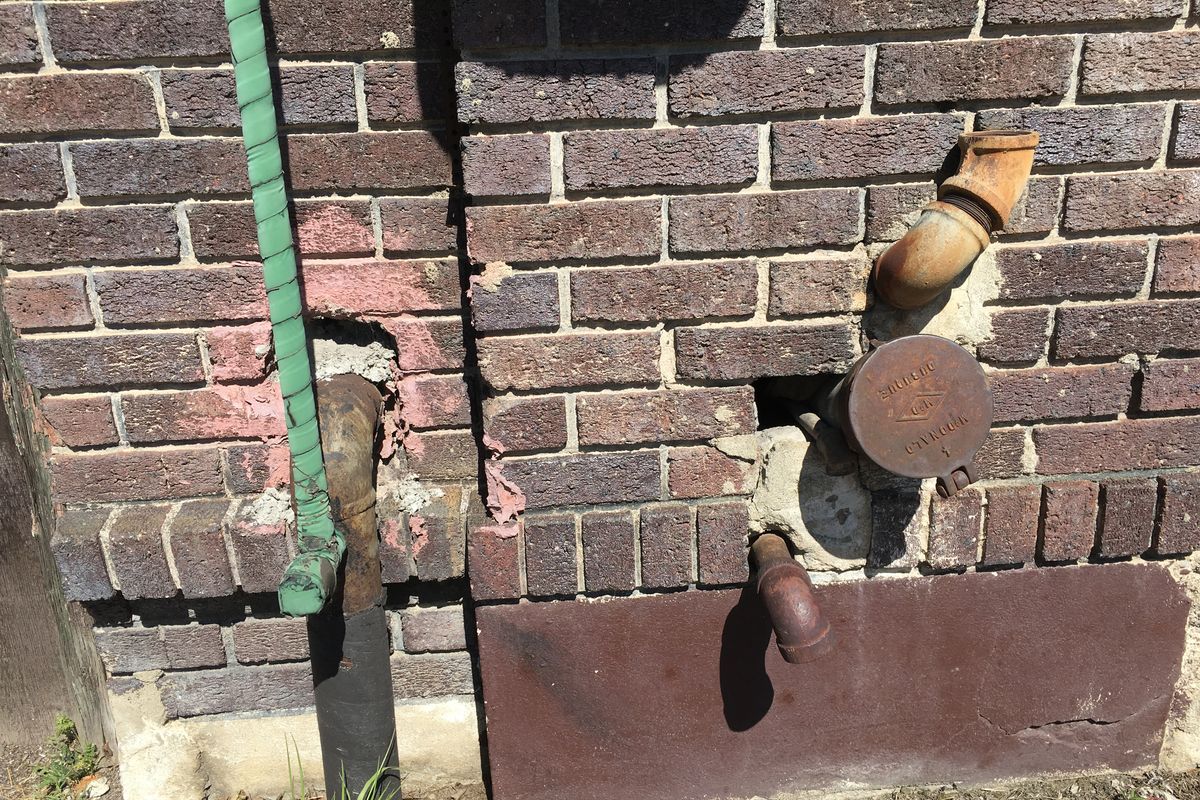 This large pipe connection probably carried milk from trucks into the holding tanks inside the Benewah Creamery, now the home of CDA Inc., an office furniture and design business. 