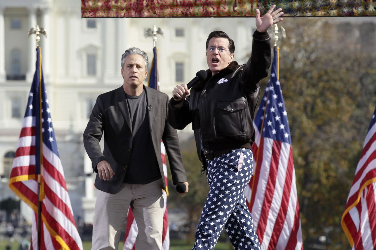Comedians Stephen Colbert, right, and Jon Stewart perform  on the National Mall in Washington, D.C., on Saturday.  (Associated Press)