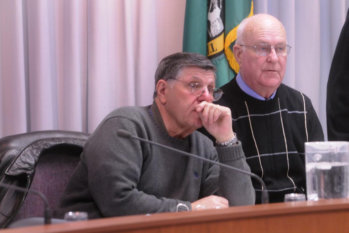 Spokane Valley Councilman Dean Grafos, left, sits next to Mayor Tom Towey before the regular meeting Jan. 19. (J. BART RAYNIAK)