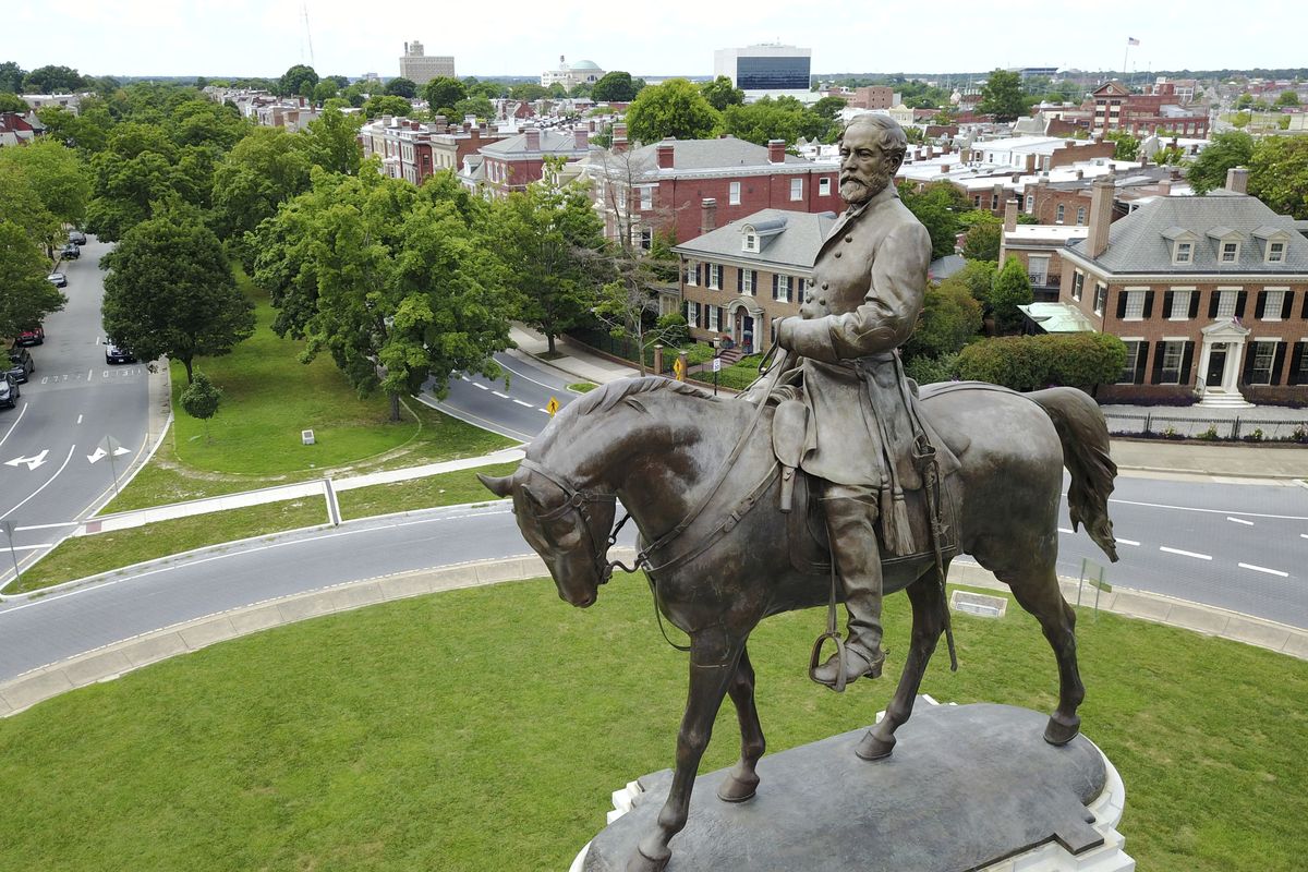 FILE - In this June 27, 2017 file photo a statue of Confederate Gen. Robert E. Lee stands in the middle of a traffic circle on Monument Avenue in Richmond, Va. If a court clears the way for the state of Virginia to take down one of the country