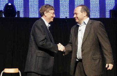 
Microsoft Chairman Bill Gates and RealNetworks Chairman and CEO Rob Glaser at a news conference announcing a new digital music and games partnership Tuesday.
 (Associated Press / The Spokesman-Review)