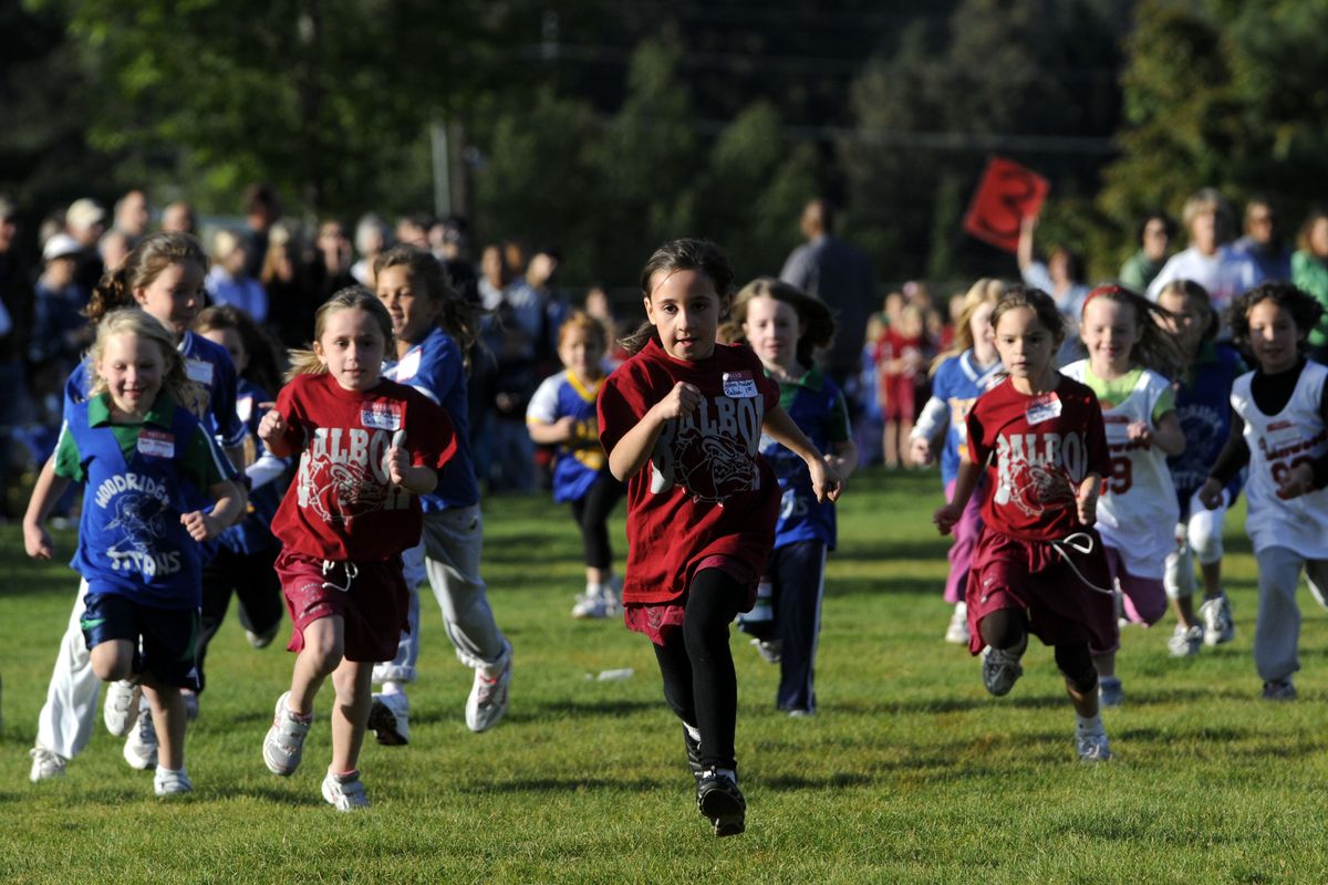 First-grade girls from various elementary schools start their race at a cross country meet in north Spokane. (Jesse Tinsley / The Spokesman-Review)
