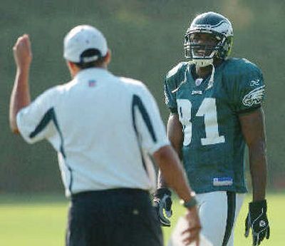 
Terrell Owens gets direction upon his return to Eagles camp. 
 (Associated Press / The Spokesman-Review)