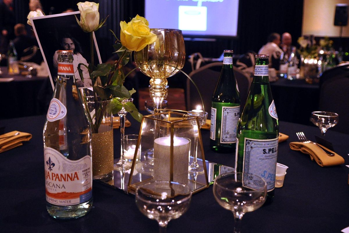 Centerpieces at the first Spokane Culinary Arts Guild Awards gala, held Tuesday night in Spokane Valley, featured photos of chefs. (Adriana Janovich / The Spokesman-Review)
