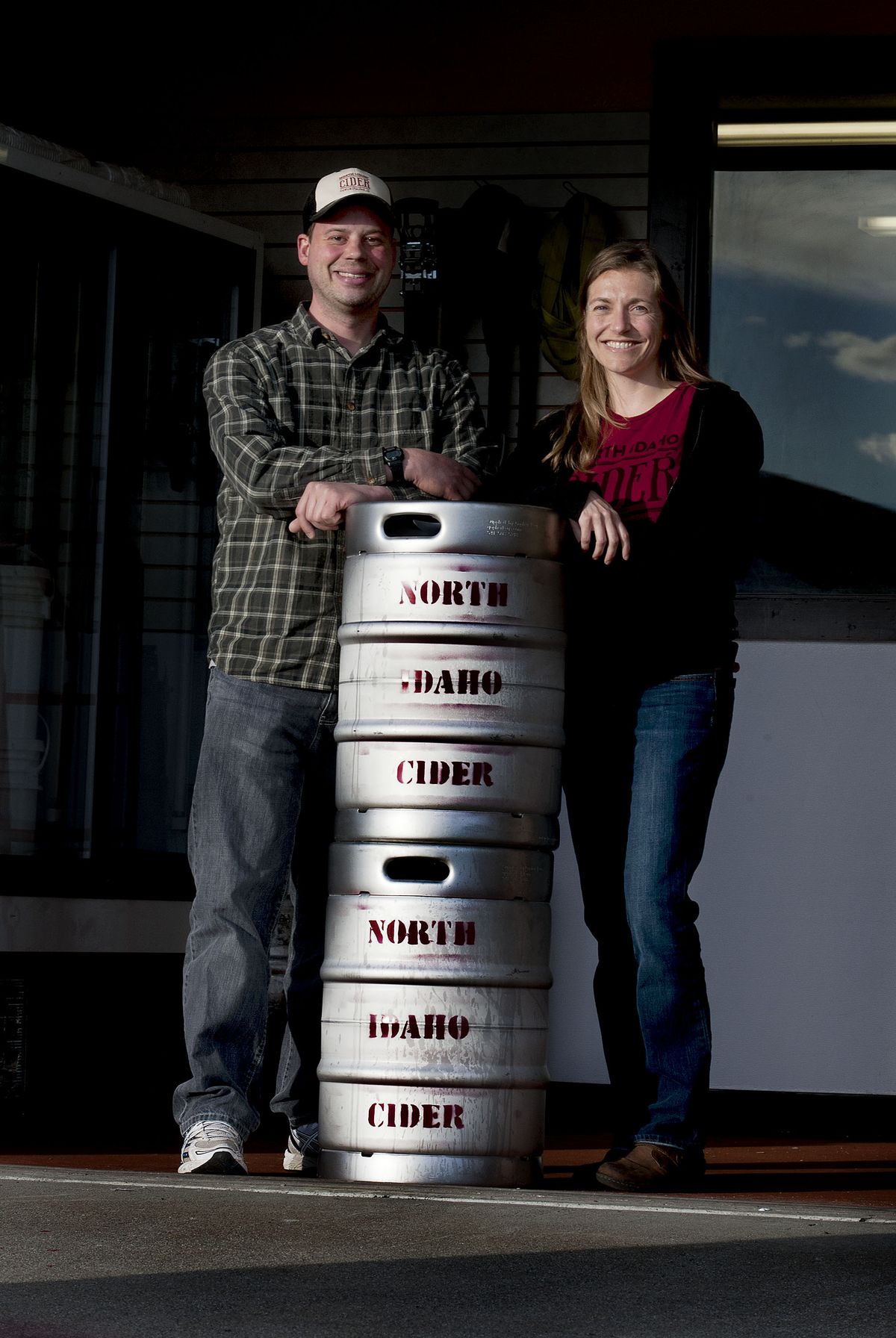 Greg and Mara Thorhaug talk about their new business, North Idaho Cider, at the facility in Hayden. They became interested in cider during a trip around the world from 2010 to 2012, sampling ciders from Argentina to Spain to New Zealand. (Kathy Plonka)