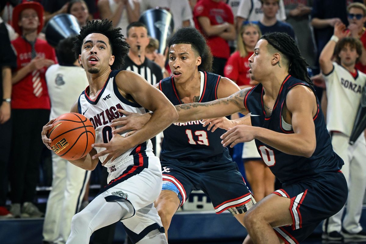 Lewis-Clark State guard MaCarhy Morris reaches for the ball as Gonzaga’s Ryan Nembhard looks to the basket during the first half of Friday’s exhibition game.  (COLIN MULVANY/THE SPOKESMAN-REVIEW)