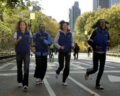 
From left, Jen Rhines; Susan Chepkemei; Jelena Prokopcuka; and Lornah Kiplagat run near the finish of the New York Marathon during a photo shoot.
 (Associated Press / The Spokesman-Review)