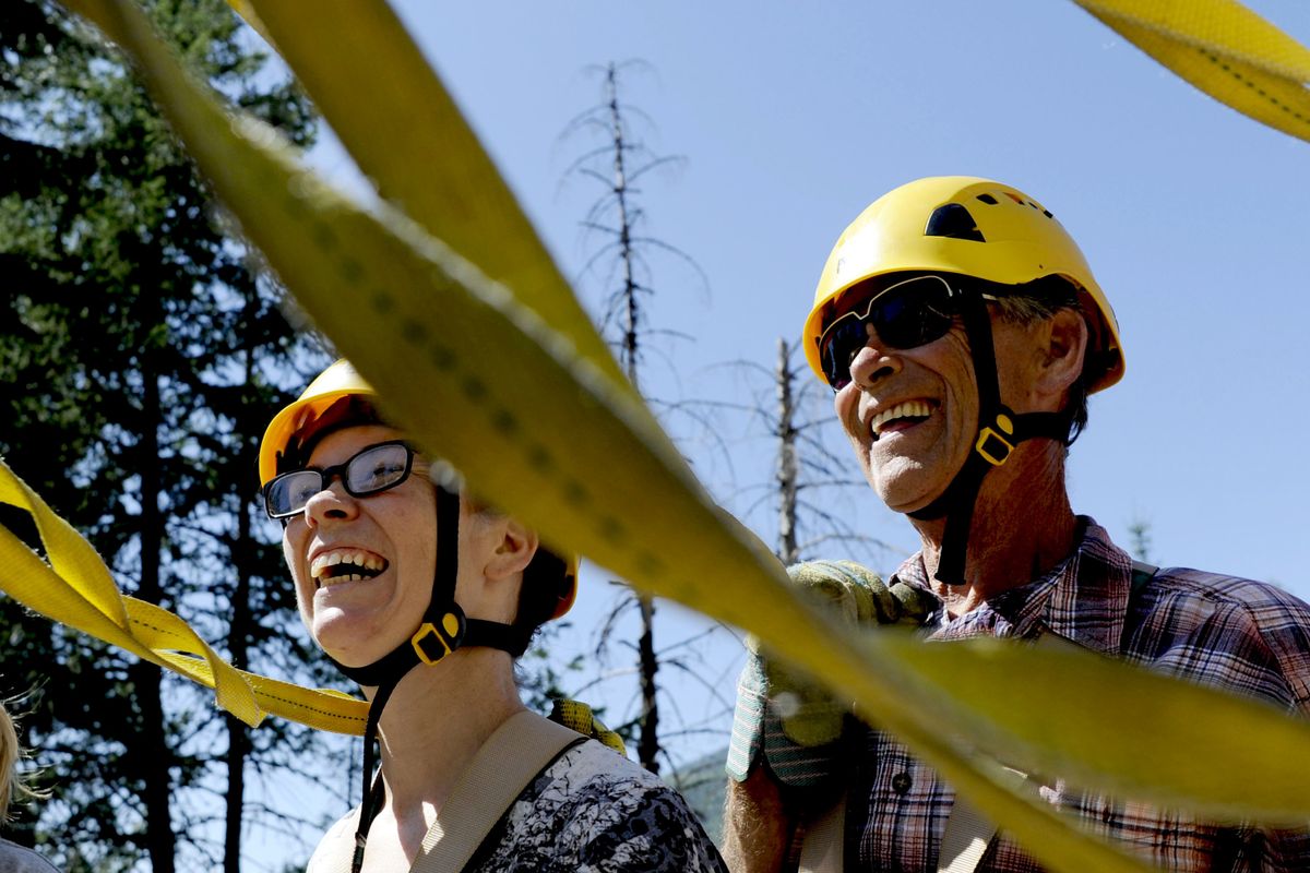 Valerie Wade, left, of Pinehurst, Idaho, and her father, Ted Wentz, are all smiles at Silver Streak Zipline Tours in Wallace. (Kathy Plonka)