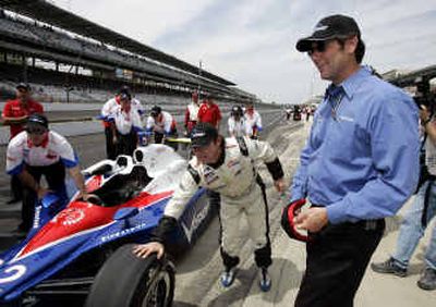 
Indianapolis Motor Speedway Corp. president Tony George, in his other role as car owner, watched as his driver, Jeff Ward, pushed his car after qualifying for Sunday's race. 
 (Associated Press / The Spokesman-Review)