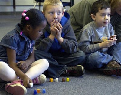 
Precious McKinney, 5, left, Dylan Carr, 6, and Christopher Aguilar, 5, use  blocks in a Kindervention class Thursday at Progress Elementary School in Spokane Valley. 
 (Liz Kishimoto / The Spokesman-Review)