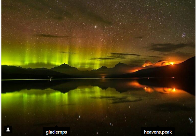 The northern lights illuminate the sky above a forest fire that's forcing evacuations from Lake McDonald all the way up to Logan Pass in Glacier National Park over the Labor Day weekend. (heavenspeakphotography.com / via Glacier National Park)