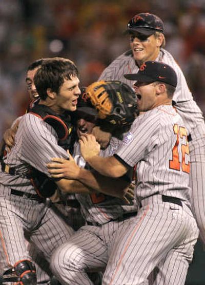 
Oregon State players celebrate after winning their second straight College World Series. Associated Press
 (Associated Press / The Spokesman-Review)