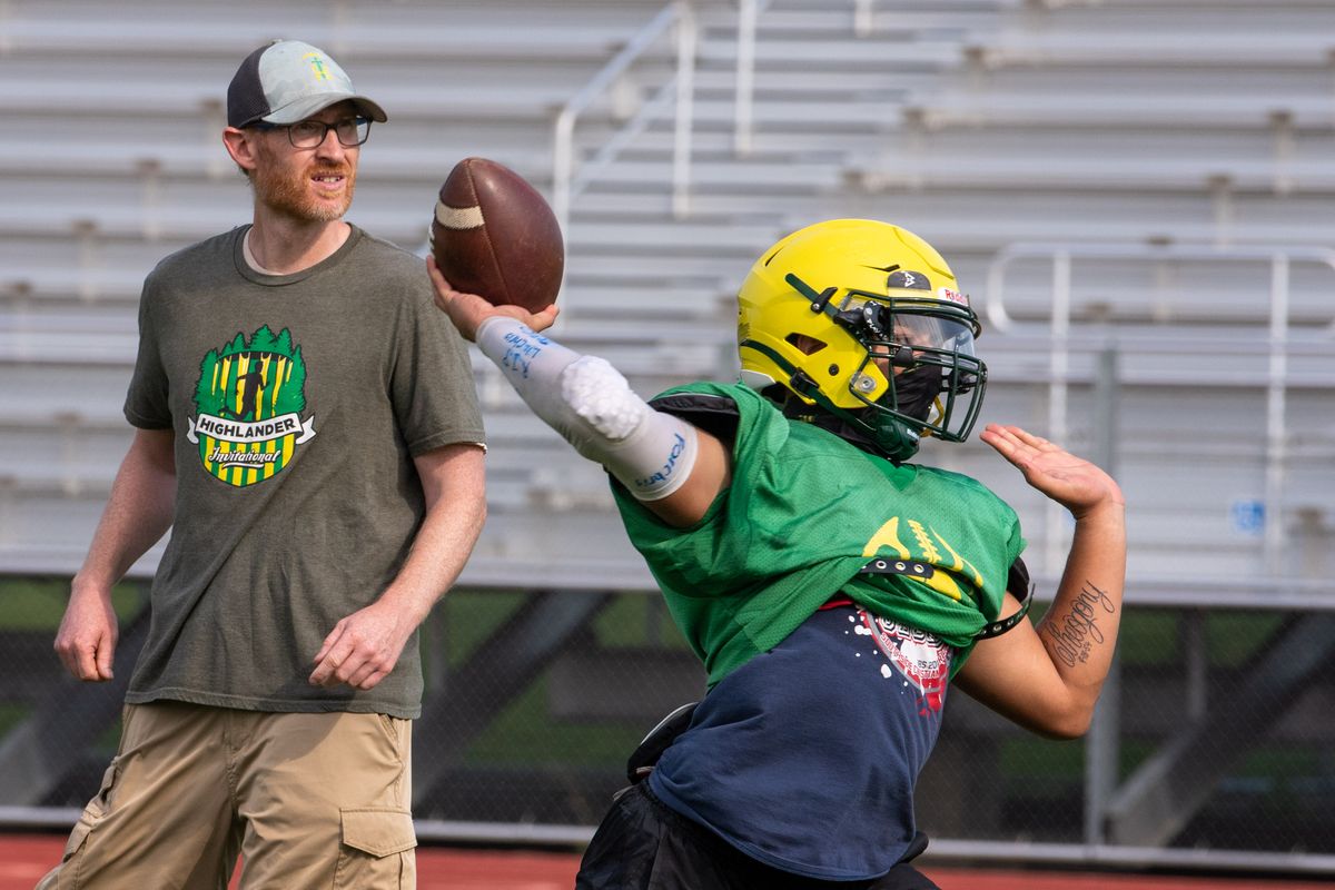 Shadle Park coach Jim Mace works with his quarterbacks during practice on Thursday, Aug. 26, 2021.  (COLIN MULVANY/THE SPOKESMAN-REVIEW)