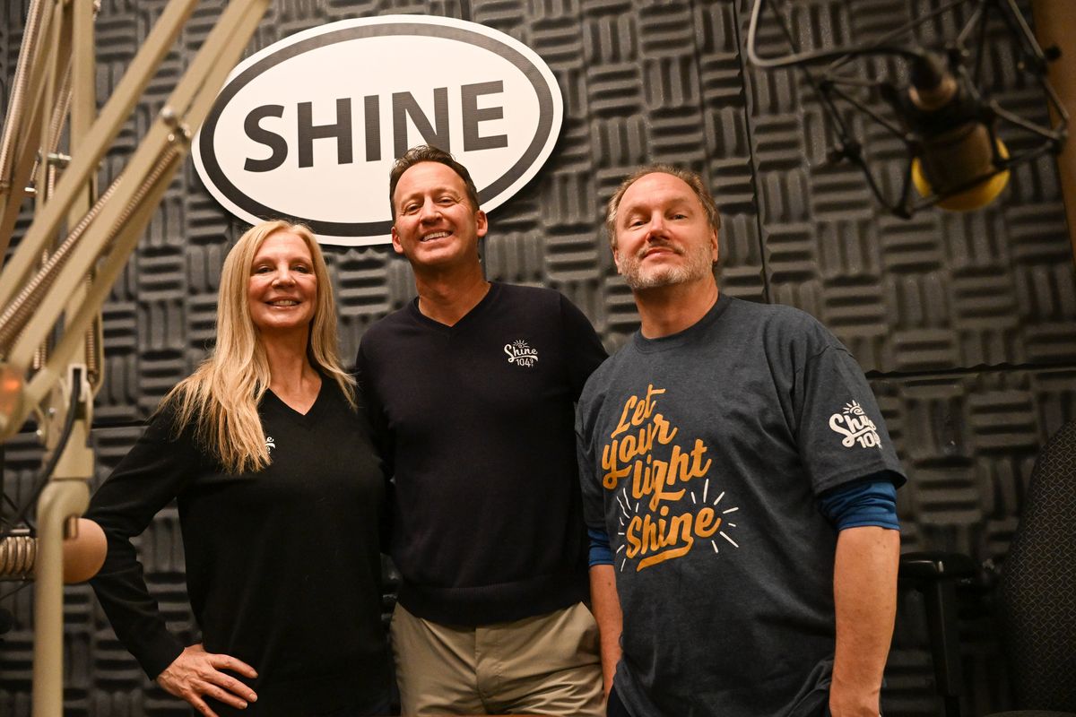 From left: Shine 104.9 radio’s afternoon-evening host Lorenda Rae, general manager Darin Patzer and morning show producer Derek Cutlip pose for a photo on Wednesday, Jan. 24, 2024, at Shine’s studios in Spokane, Wash.  (Tyler Tjomsland/The Spokesman-Review)