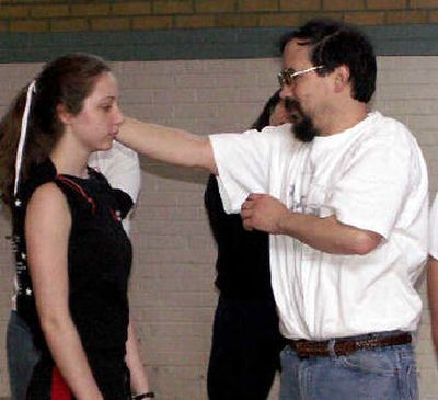 
Fight instructor Mike Winderman works with Erin Anders  in the production of 