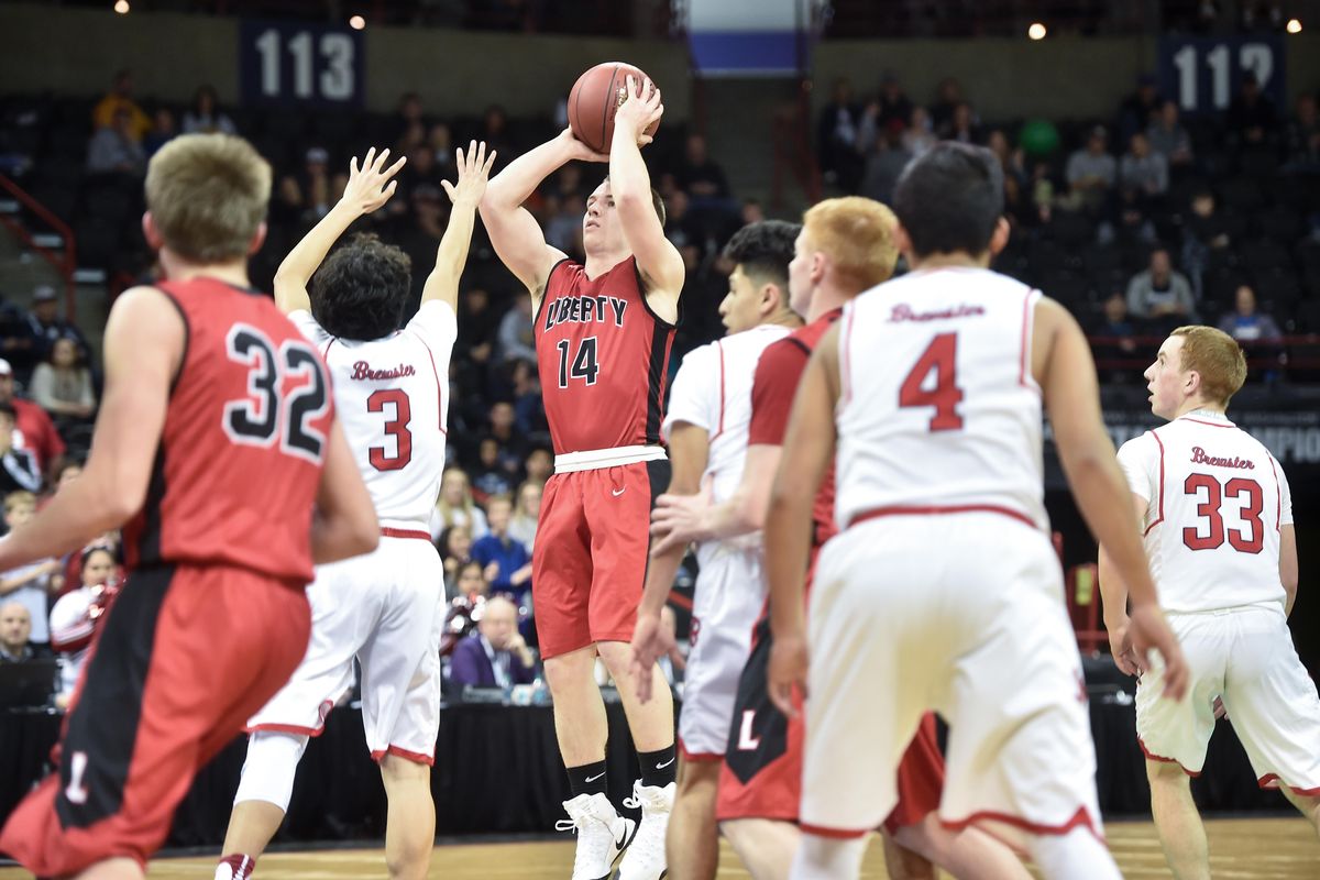 Liberty Tyler Haas (14) shoots against Brewster during the first round of the WIAA 2b Boys Hardwood Classic on Wednesday, March 1, 2017, at Spokane Arena in Spokane, Wash. (Tyler Tjomsland / The Spokesman-Review)