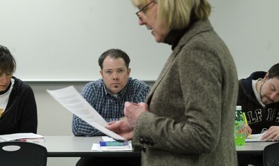 Mountain View teacher, Paul Uzzi, center listens as University of Idaho instructor Kathy Canfield-Davis gives a talk during an educational leadership class.  (Kathy Plonka / The Spokesman-Review)