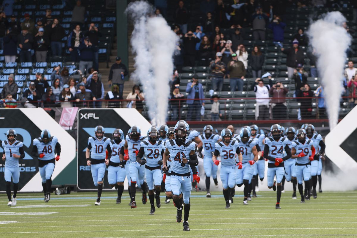 The Arlington Renegades, a team constructed by Spokane native Rick Mueller, run onto the field before an XFL football against the Vegas Vipers on Saturday in Arlington, Texas.  (Tribune News Service)