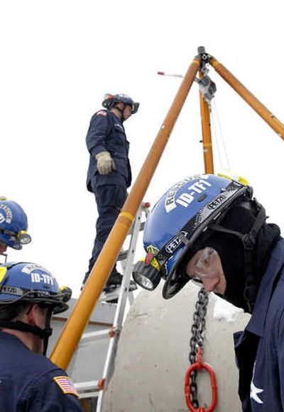 
Coeur d'Alene firefighter Matt Sowa, front, works through heavy-rigging training at the new training facility in Coeur d'Alene on  Dec. 12.  
 (Kathy Plonka / The Spokesman-Review)