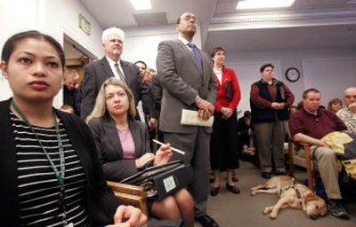 
An overflow crowd listens to testimony on a gay rights bill during a public hearing on Tuesday in Olympia. The bill would ban discrimination on the basis of sexual orientation.
 (Associated Press / The Spokesman-Review)