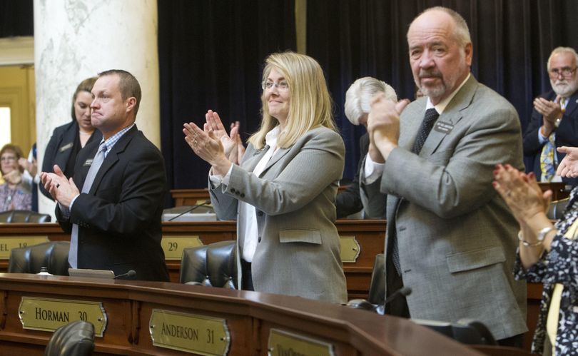 Rep. Wendy Horman, R-Idaho Falls, center, and her House colleagues, including Rep. Neil Anderson, R-Blackfoot, right, applaud the end of the legislative session, Wednesday, March 29, 2017, in Boise, Idaho. (Katherine Jones / AP/Idaho Statesman)
