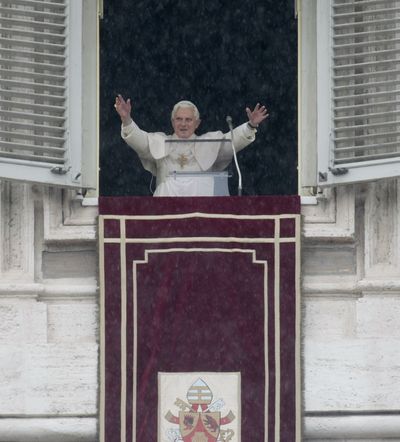Pope Benedict XVI greets the faithful in St. Peter’s Square from his studio at the Vatican on Saturday.  (Associated Press)