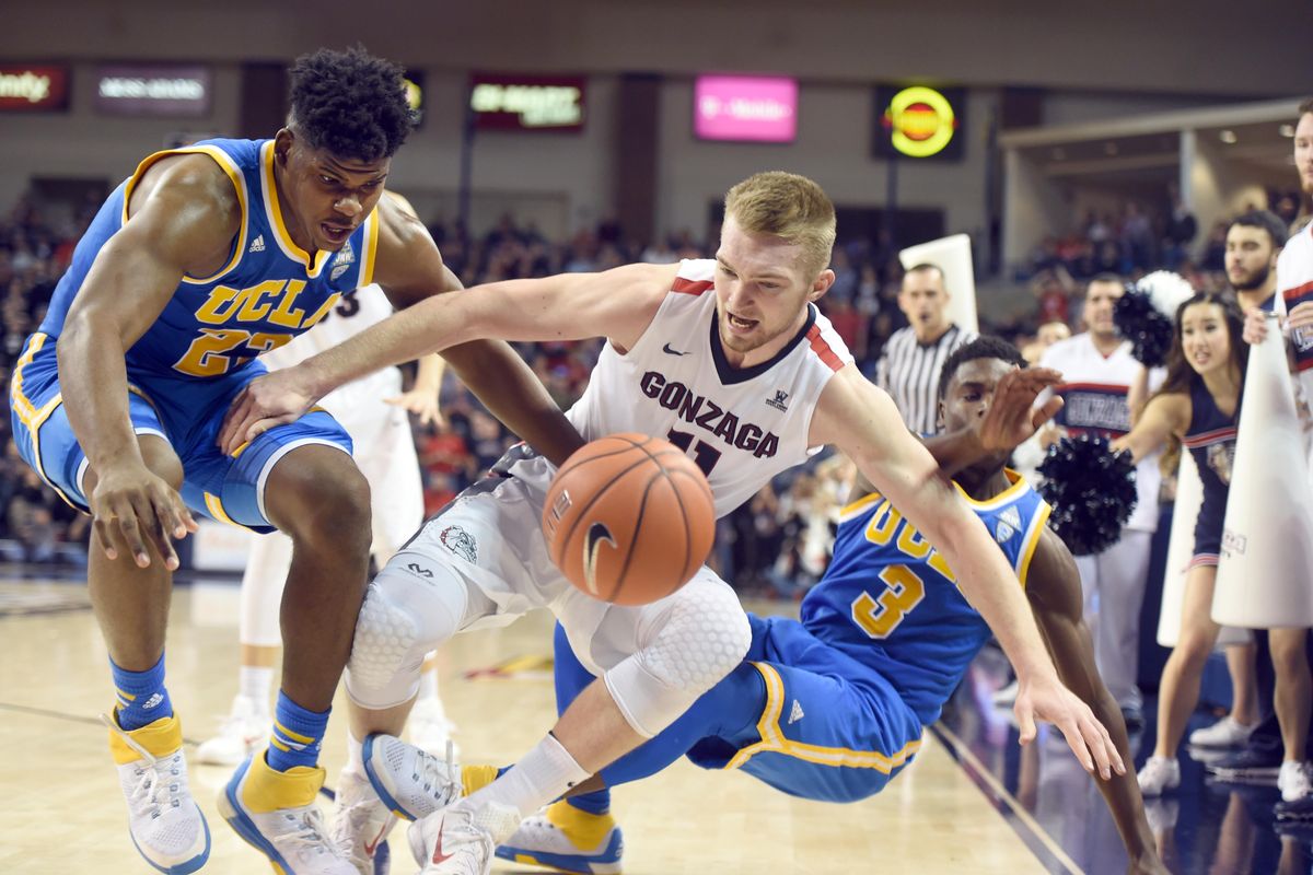 Gonzaga’s Domantas Sabonis chases his own blocked shot surrounded by UCLA’s Tony Parker, left, and Aaron Holiday, right, on the sidelines in the second half Saturday, Dec. 12, 2015 at McCarthey Athletic Center. UCLA edged the Zags 71-66. (Jesse Tinsley / The Spokesman-Review)