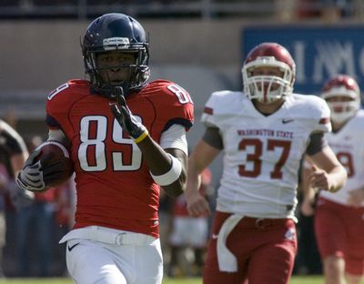 Associated Press Arizona’s Travis Cobb took the opening kick 97 yards for a TD. (Associated Press / The Spokesman-Review)