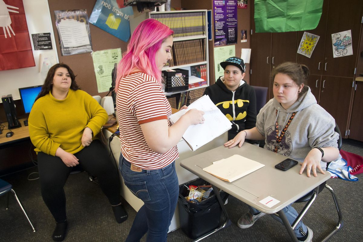 Rogers High School Gay Straight Alliance club members, from left, Jaycie Stierwalt, 16, Skyler Rua, Branden Roy, 16, and Zoe Augirre,16, help plan club activities during a weekly meeting, Monday, April 10, 2017, at Rogers High School. (Colin Mulvany / The Spokesman-Review)