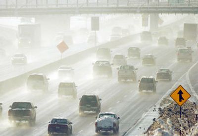 
Vehicles kick up moisture  Saturday on Interstate 25 in downtown Denver.  
 (Associated Press / The Spokesman-Review)