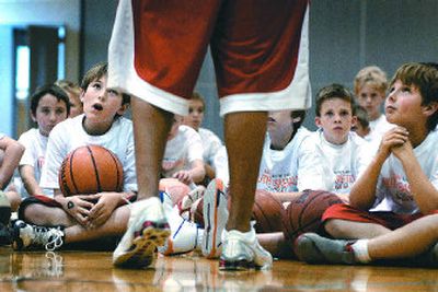 
Young players are in awe as J.P. Batista discusses strategy during a basketball clinic held at Central Valley HS last week. 
 (Jed Conklin / The Spokesman-Review)