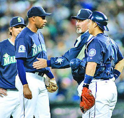 
Mariners starter Miguel Batista, second from left, is pulled from the game. 
 (Associated Press / The Spokesman-Review)