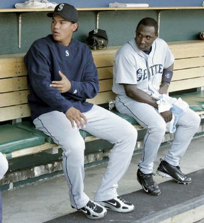 Seattle Mariners pitcher Felix Hernandez, left, and infielder Yuniesky Betancourt are getting a taste of the big leagues.
 (Associated Press / The Spokesman-Review)