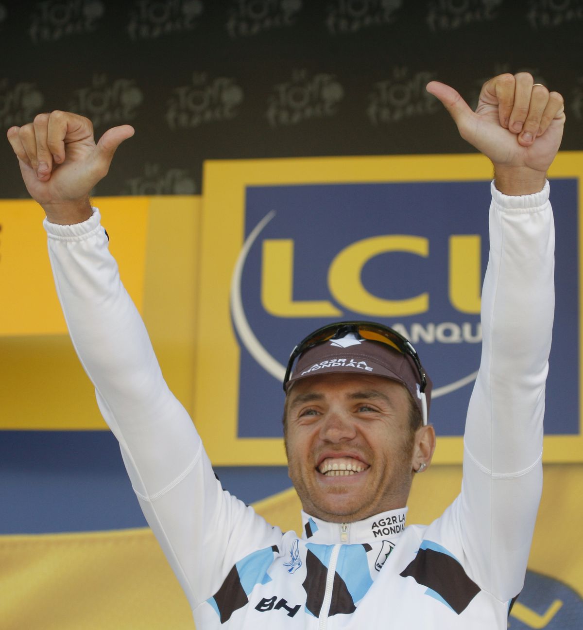 Rinaldo Nocentini of Italy reacts on the podium after taking the overall lead.   (Associated Press / The Spokesman-Review)