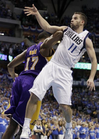 The Lakers’ Andrew Bynum commits a flagrant foul against the Mavericks’ J.J. Barea. Bynum was ejected. (Associated Press)