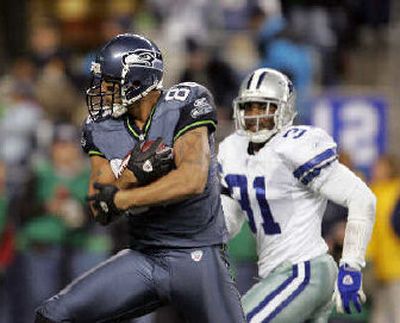 
Jerramy Stevens, left, catches a 37-yard touchdown pass in front of the Dallas Cowboys' Roy Williams in the fourth quarter of last week's playoff. He had two TD catches in the game. 
 (Associated Press / The Spokesman-Review)