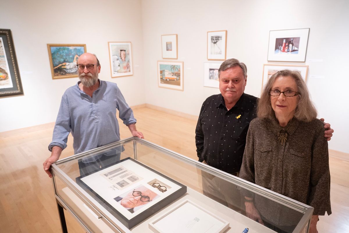 Longtime art collectors Les and Carolyn Stephens, right, are joined Tuesday by art professor Robin Dare in the Jundt Art Museum in the middle of the display of their 50-year collection of contemporary art which Dare curated into a single show. The collection includes paintings, prints, sculpture and multimedia pieces.  (Jesse Tinsley/THE SPOKESMAN-REVIEW)