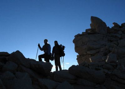 
Investigators at Western Illinois University in Macomb, Ill., and Willamette University in Salem have found that hiking downhill using poles eases strain on knees and ankles, even when carrying a heavy pack.
 (File / / The Spokesman-Review)