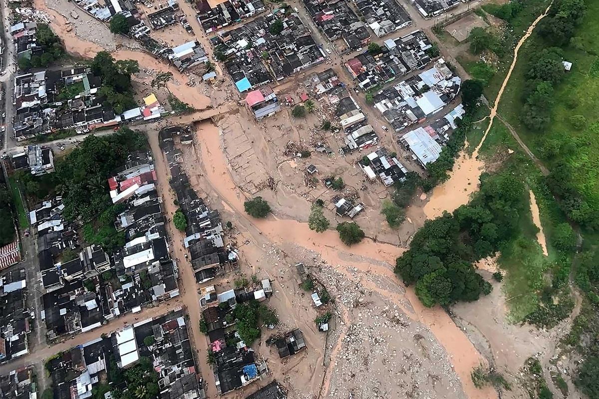 Aerial view of a portion of Mocoa, Colombia, Saturday, after an avalanche of water from an overflowing river swept through the city as people slept. The incident triggered by intense rains left at least 150 people dead in Mocoa, located near Colombia's border with Ecuador. (Cesar Carrion / Colombian Presidential Press Office via Associated Press)