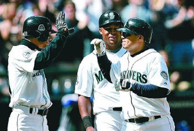 
After struggling at the plate, Seattle designated hitter Jose Vidro, right, enjoyed a 3-for-5 game Sunday that included two home runs. 
 (Associated Press / The Spokesman-Review)