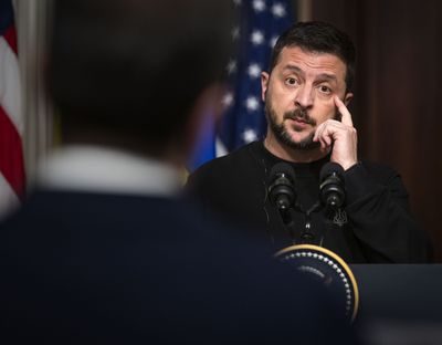 Ukrainian President Volodymyr Zelensky addresses reporters at a news conference with President Biden in Washington on Dec. 12.    (Bill O'Leary/The Washington Post)