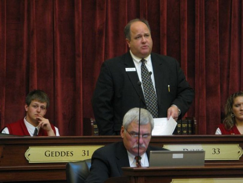 Senate Majority Leader Bart Davis, R-Idaho Falls, leads the Senate through its orders of business on Monday afternoon in preparation to take up the public school budget, SB 1418, which includes historic cuts for schools next year. (Betsy Russell)