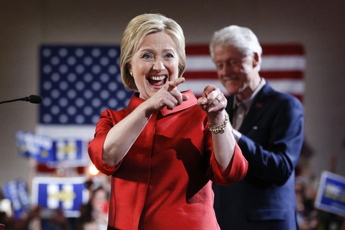 Democratic presidential candidate Hillary Clinton, left, greets supporters with her husband and former President Bill Clinton at a Nevada Democratic caucus rally, Saturday, Feb. 20, 2016, in Las Vegas. (John Locher / Associated Press)