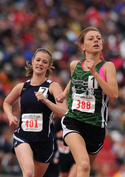 Northwest Christian-Colbert's Anna Henry leads Northwest Christian-Lacey's Elizabeth Weber in the late stages of the 1,600-meter run during the State 2B track championships at EWU. Weber ended up passing Henry to take second in the event with a time of 5:17.6. Colfax's Morgan Willson won the event with a time of 5:14.1. (Tyler Tjomsland)