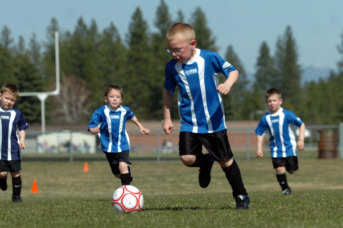 C.J. Niska, 5, dribbles the ball in a Spokane Youth Sports Association game at Farwell Rd. field complex Saturday, April 12, 2008. (Jesse Tinsley / The Spokesman-Review)