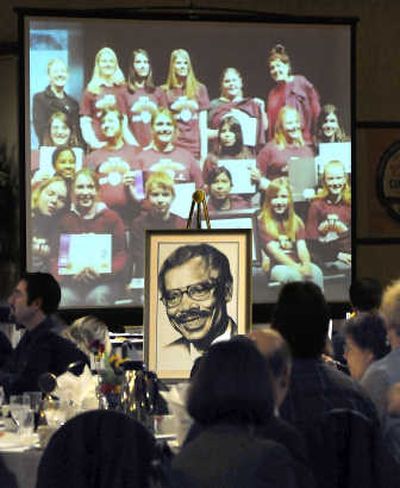 
A portrait of former Spokane Mayor Jim Chase is framed by a video of Chase Youth Award winners Friday. 
 (Christopher Anderson / The Spokesman-Review)